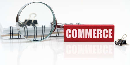 Business concept. On the table is a notebook, a magnifying glass and a tablet with the inscription -...