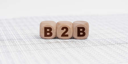 Business and finance concept. There are cubes on the reporting documents with the inscription - B2Bの写真素材