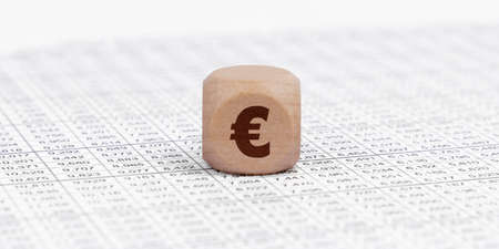 Business and finance concept. There is a cube with a euro sign on the accounting documents.の写真素材