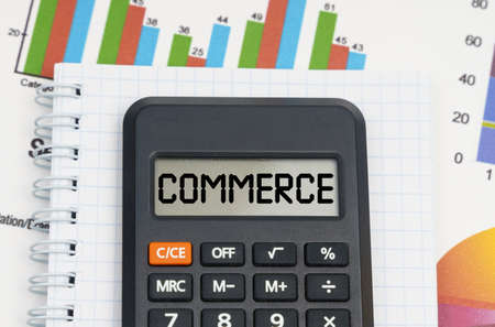 Business and economy concept. On the table are charts, a notebook and a calculator with the...
