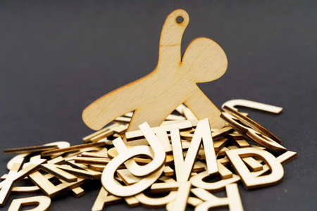Problems, business and health. The figurine of the wooden man is littered with problems - letters. Asks for help.の写真素材