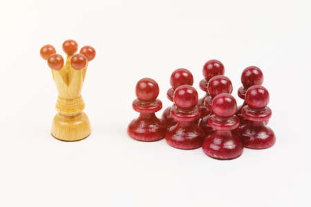 Business and politics concept. Chess, the white king leads the red pawns.の写真素材