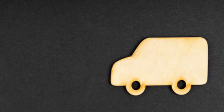 Transport and business concept. Wooden lorry on a black background. Isolated.の写真素材