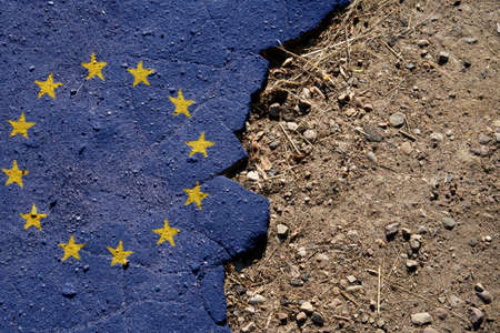 Business and politics concept. A crisis. Flag on the broken asphalt - EUの写真素材
