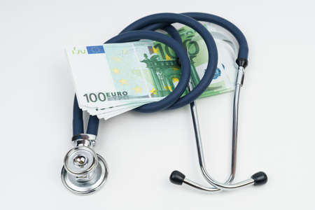 Economic crisis. The euro is swirled with a stethoscope. Economic recession symbol.の写真素材