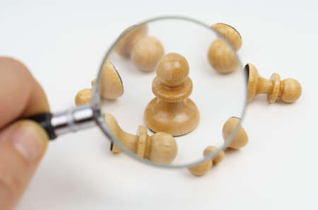 Business and finance concept. The white pawn is successfully moving up its career, eliminating...