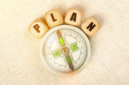 Business concept. On the table is a compass and cubes with the inscription - PLANの写真素材