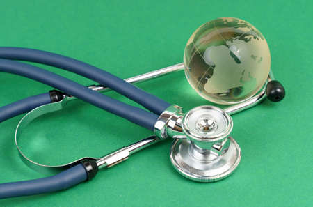 Safety of the planet. Global quarantine. Disaster, economic, environmental and medical crisis. Isolated on green.の写真素材