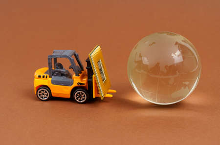 Technology and globalization concept. A toy loader brings a processor to the planet. Isolated on...