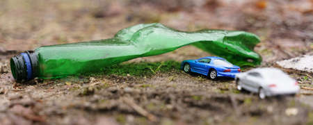 Environmental concept. People ride their cars on vacation, passing through an arch made of a plastic...