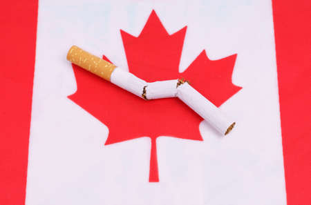 No smoking concept. The flag of Canada depicts a broken cigarette as a symbol of the harm caused by smoking.の写真素材