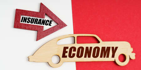 Business and economy concept. On a white and red background, a car and an arrow with the inscription...