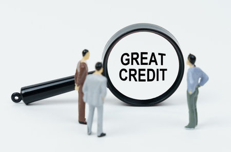 Economy and business concept. On a white background there are figures of businessmen and a magnifying glass, inside of which there is an inscription - GOOD NEWSの写真素材