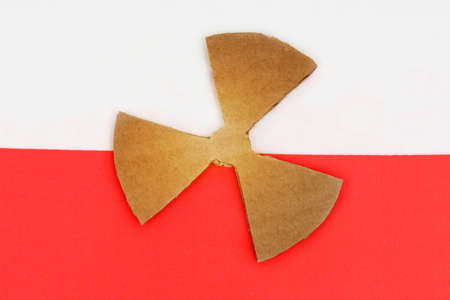 The flag of Poland has a symbol of radioactivity.