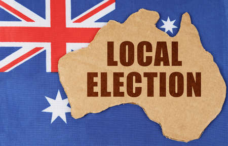 National concept of Australia. On the flag of Australia lies the contour of the map of the country...