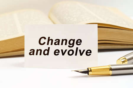 education concept. Against the background of the book lies a pen and a business card with the...