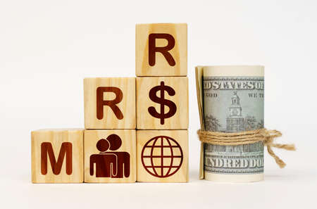 business concept. On a white surface, dollars and cubes with images and the inscription - MRRの写真素材
