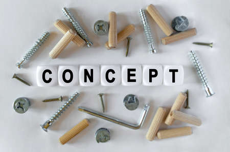 Construction business concept. On a white background, building fittings and white cubes with the...