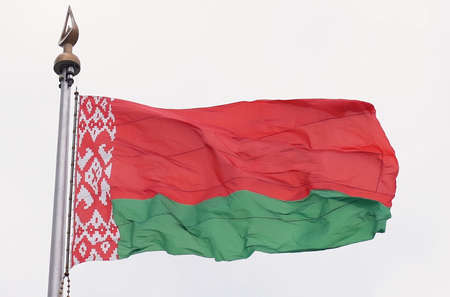 The national flag of the Republic of Belarus flutters in the wind. state symbolの写真素材