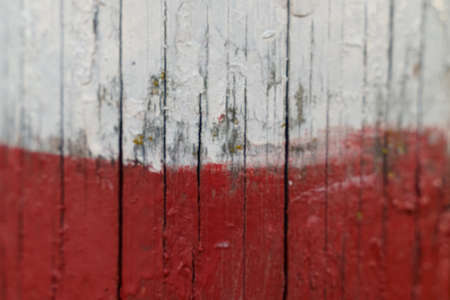 Poland flag on an old painted wooden surface. textures and backgrounds.の写真素材