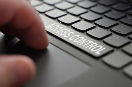technology and business concept. On the laptop keyboard of a person's hand, on the space bar there is an inscription - Access controlの写真素材