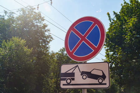 Close-up of traffic signs - No stop, Evacuation zone. Signs against the sky and trees in the cityの写真素材