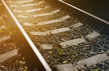 Logistics and transport concept. railway track. Close-up of the rails in the sun.の写真素材
