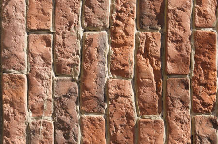 Large texture of a wall lined with red old bricks. close-up. textures and backgrounds.