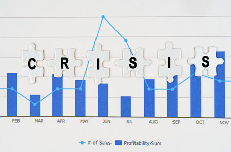 business concept. On business reports - diagrams are puzzles with the inscription - CRISISの写真素材