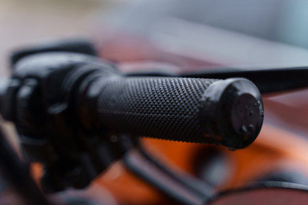 Black throttle on a motorcycle handlebar. close-up. transport concept.