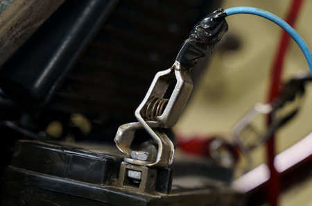 The motorcycle battery is being charged. close-up. transport concept.の写真素材