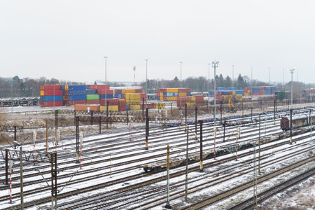 Freight unloading and loading railway station. There are empty wagons on the railway platform,...