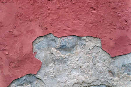Texture of destroyed red plaster on a concrete wall. background textureの写真素材