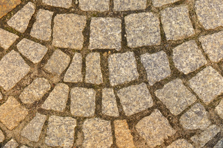 The texture of the stone pavement. Abstract background of old cobblestone close up.の写真素材