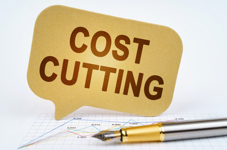 business concept. On the business diagram is a pen and a sign with the inscription - Cost cuttingの写真素材