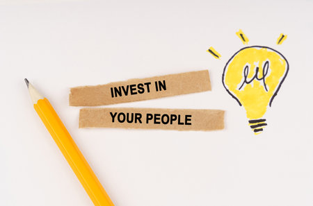 business and education concept. A luminous light bulb is drawn on a white background, next to it...