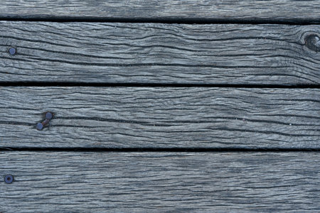 Vintage gray wooden background with nails. Horizontal frame.の写真素材