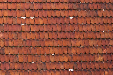 Orange texture of lamellar tiles on the roof. Texture and backgrounds.の写真素材