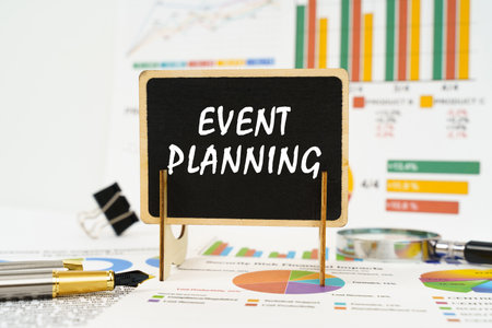 Business concept. Against the background of business graphs, a board with the inscription - Event Planningの写真素材