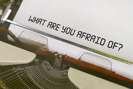 Economy and finance concept. The text is printed on a typewriter - What Are You Afraid Ofの写真素材
