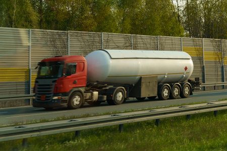 Transportation of liquid chemical products by road along the highway. Logistics concept. Motion blurred.の写真素材