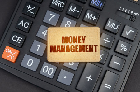 Financial concept. There is a sign on the calculator that says - Money management