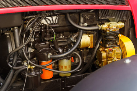 A detailed view of the complex engine components inside a modern tractor, demonstrating the...