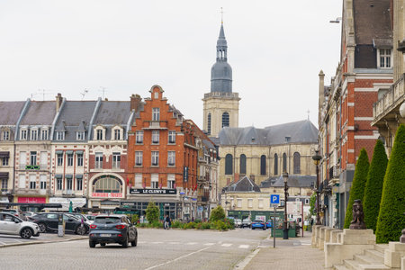Cambrai, France - May 21, 2023: A city street lined with numerous tall buildings, creating a dense urban skyline against the sky.のeditorial素材
