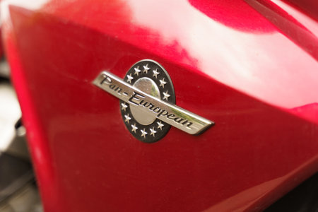 Cambrai, France - May 21, 2023: A detailed view of the emblem on a red Pan European motorcycle,...