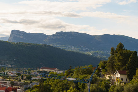 A scenic view of a French hillside with mountains in the distance.の写真素材
