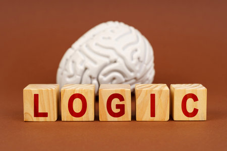 A depiction highlighting the relationship between logic and brain activity, using wooden blocks and...
