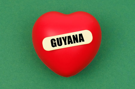 A bright red heart with Guyana inscribed on it expresses deep love and pride for the nations capital, capturing the essence of the citys spirit.の写真素材