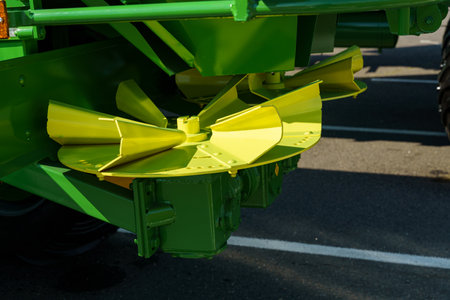 Close-up view of modern agricultural equipment, showing a unique component designed for efficient crop processing. This machinery represents advancements in technology for farming.の写真素材