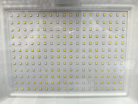 A detailed view of a well-arranged LED light panel showing numerous small bulbs set in a grid pattern.の写真素材